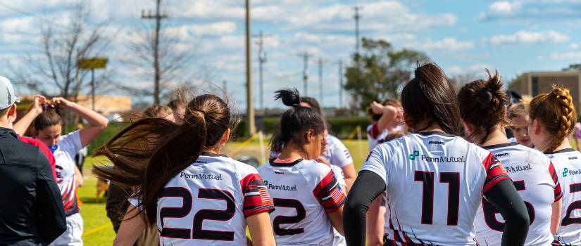 women's rugby captains and officers huddling