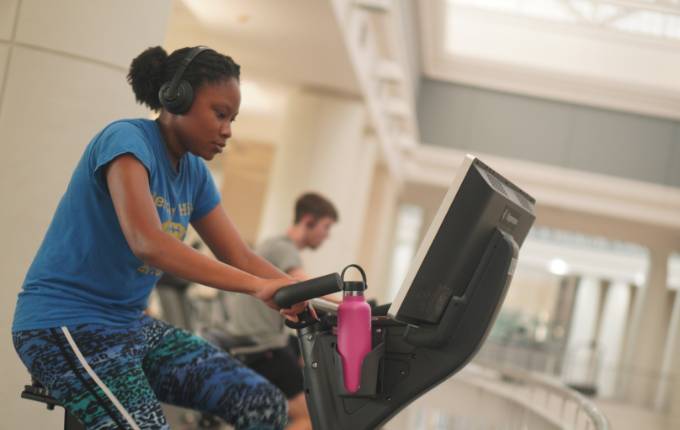 Student biking on our third floor cardio deck.