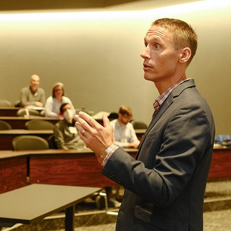 professor teaching in front of a class