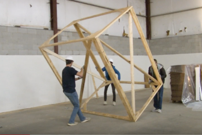 Engineering students work to build a wooden Tiger.