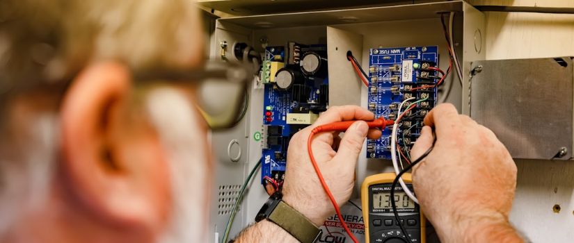 employee working with wires and connections