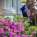 Flag and flowers in front of a building