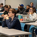 students sit in a classroom