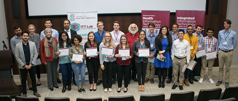 All of the conference's participants stand for a photo.