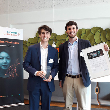 Kevin and Jack hold their award.