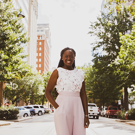 Andrea Ogunleye stands in downtown columbia