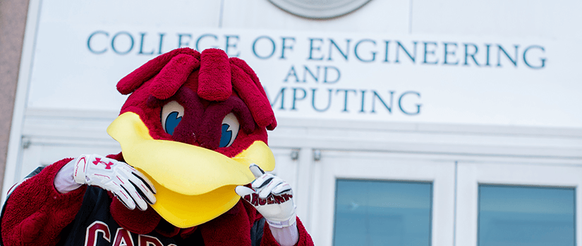 USC Mascot Cocky in front of CEC logo