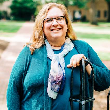 Dr. Kay Edwards standing on the Horseshoe sidewalk