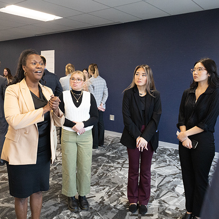 Students listen to a networking specialist at a professional development seminar.