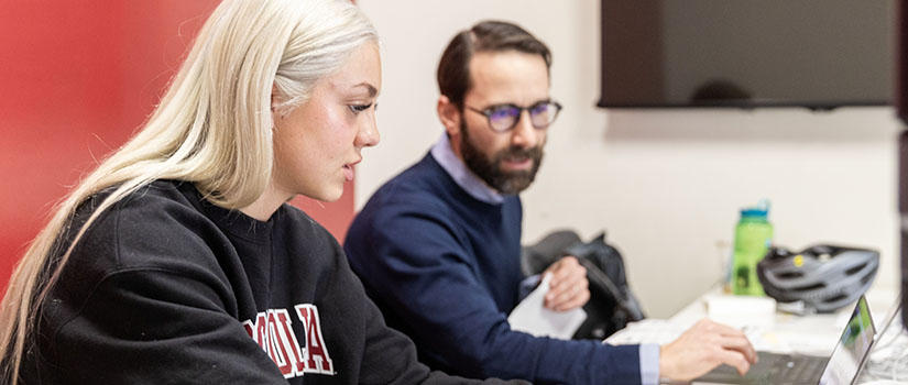 Student working with Tax Clinic director