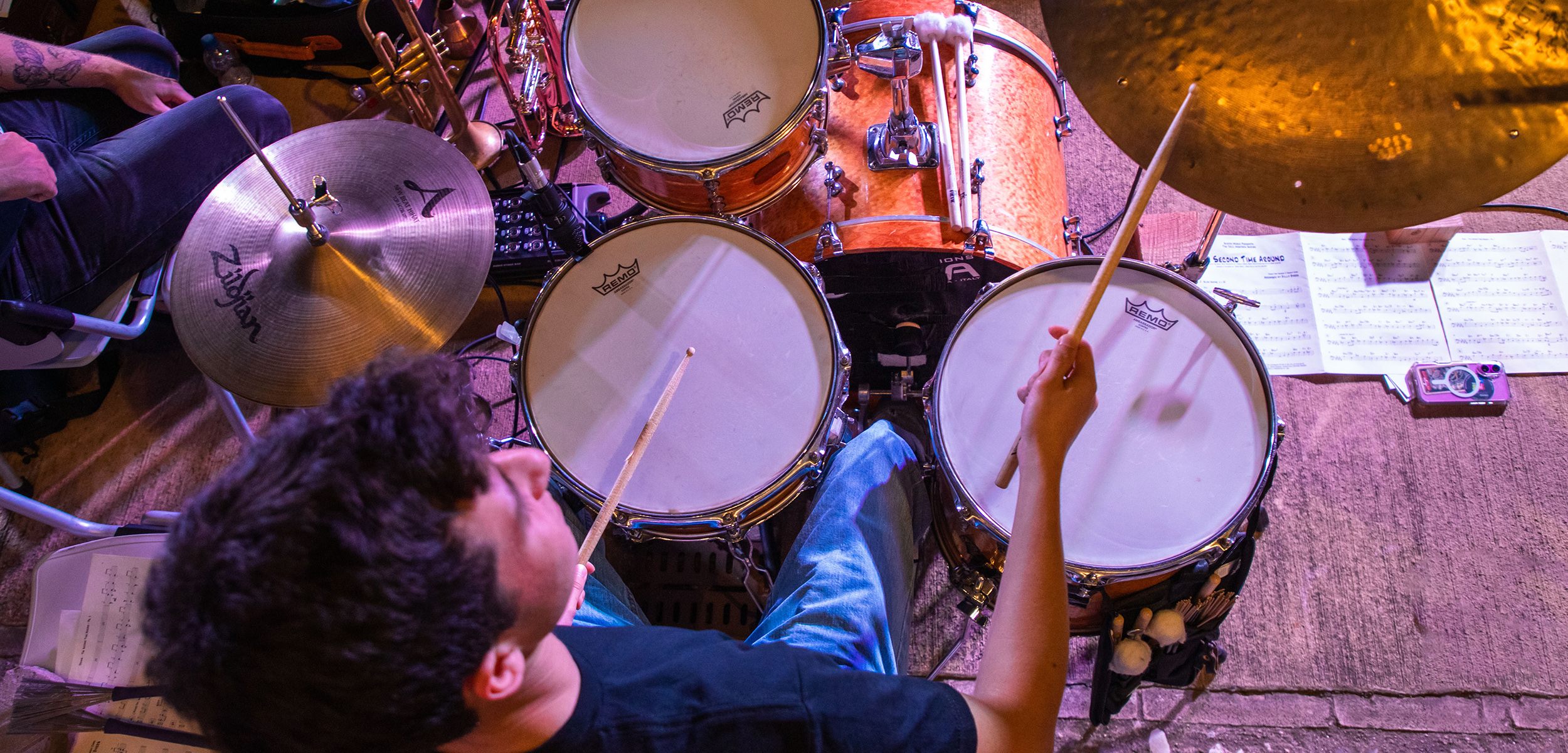 birds-eye view of a drummer at a drum kit