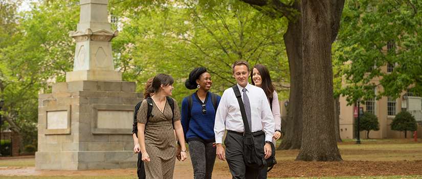 students walking across campus 