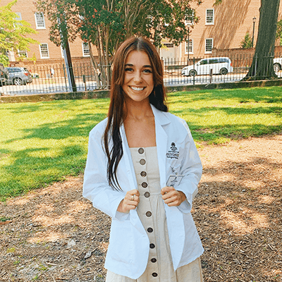 Female student in white coat