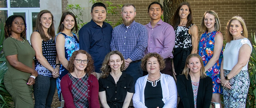 TecHealth faculty, staff, students and affiliated scholars posing on a balcony