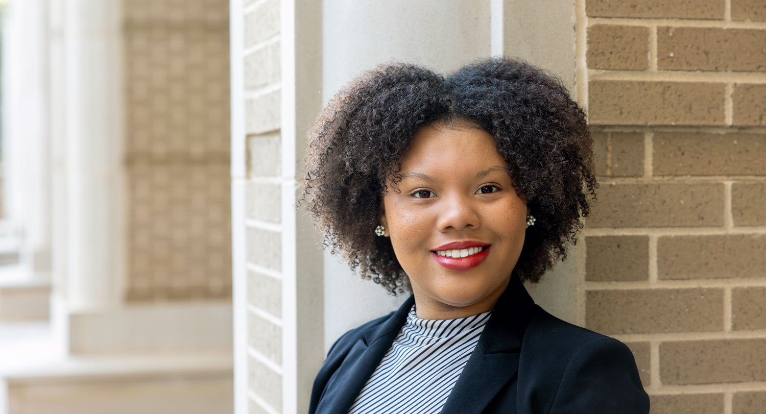 Portrait of public health senior Ebony Christie outside the Arnold School