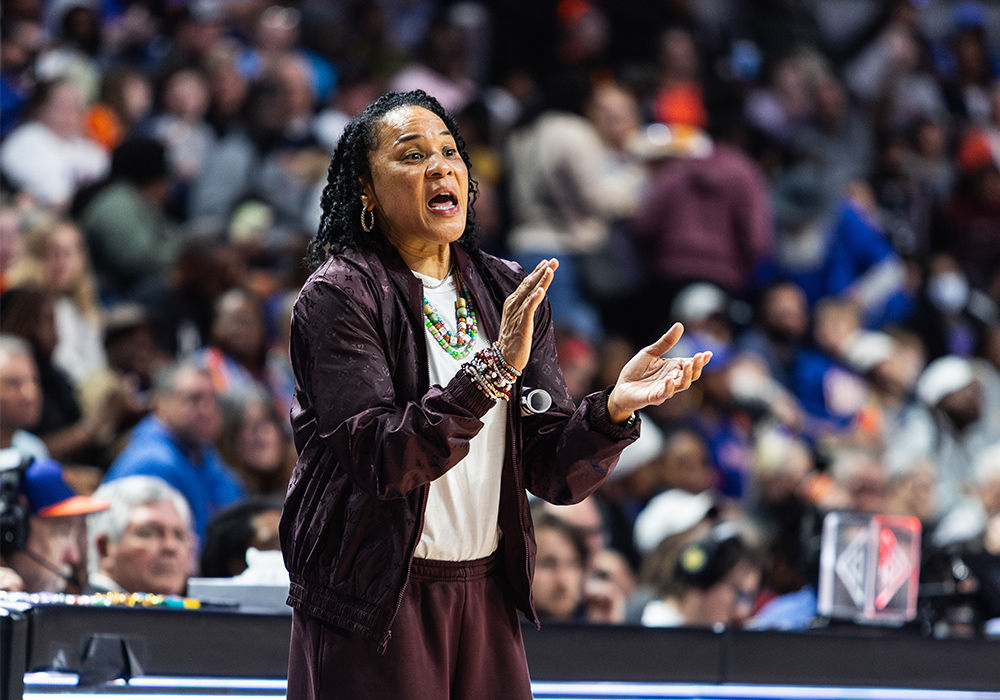 Dawn Staley coaches her team from the sidelines during a game
