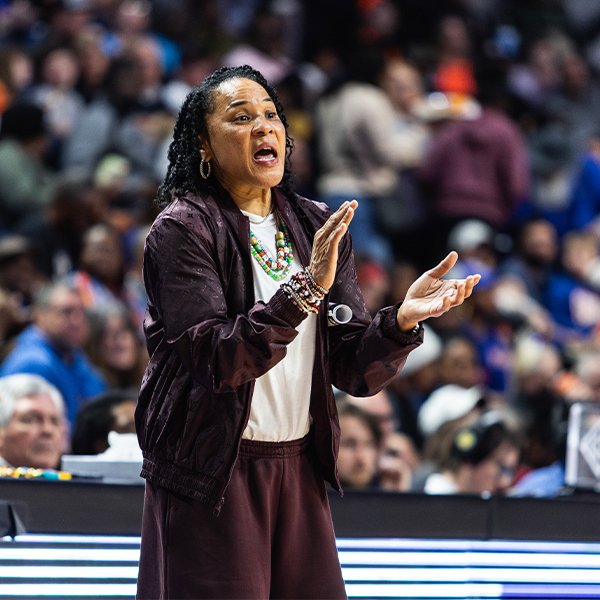 Dawn Staley coaches her team from the sidelines during a game
