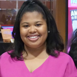 Amelia wilks wearing a pink shirt