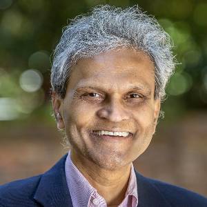 Portrait of Sanjay Ahire in a blue jacket dress shirt