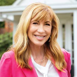 Leeza Gibbons poses for the camera in front of Leeza’s Care Connection in Irmo.