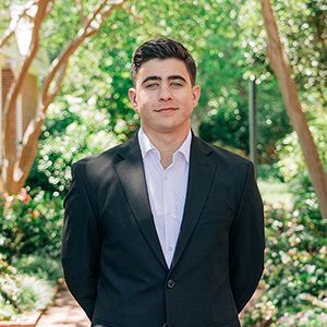 Young man standing in a campus environment