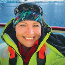 Brandi Revels smiles for the camera during her trip in Antarctica
