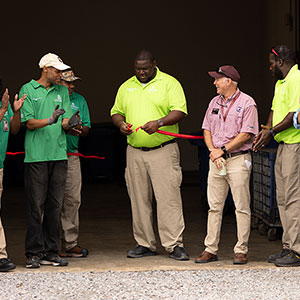 Dameon Hopkins, Waste and Recycling Manager, cuts the ribbon on the new Waste and Recycling Services home at 350 Wayne St.