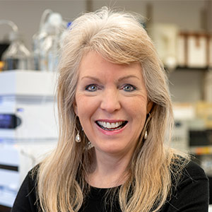 head and shoulders photo of Susan Richardson standing in her chemistry lab
