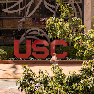 garnet block USC letters in front of Russell House