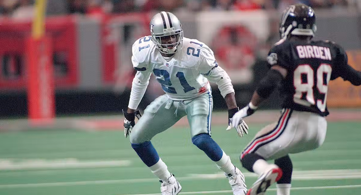 Two football players face each other on the field