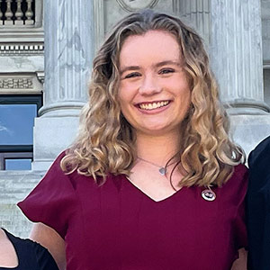 Blakely Hardin stands on the steps of the statehouse.