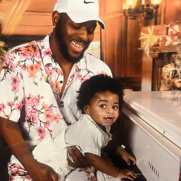 Ira Hogg and his son at the piano