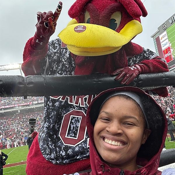 Kennedy Williams and Cocky at a USC football game.