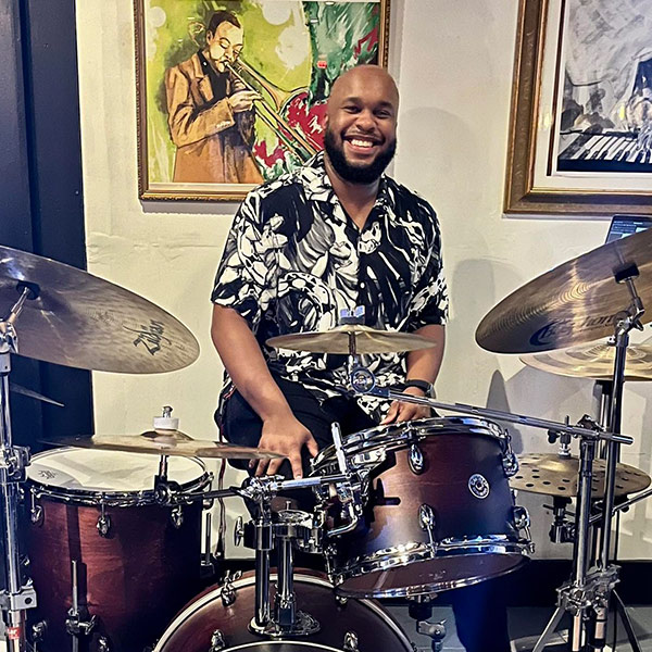 Malik Pratt plays the drums,